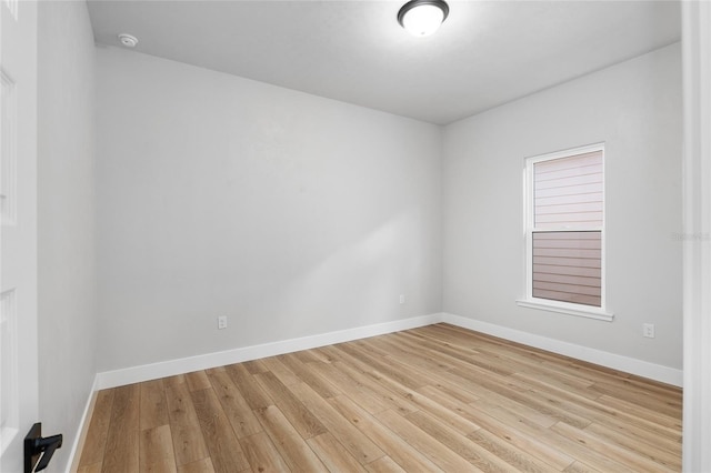 spare room featuring light hardwood / wood-style flooring