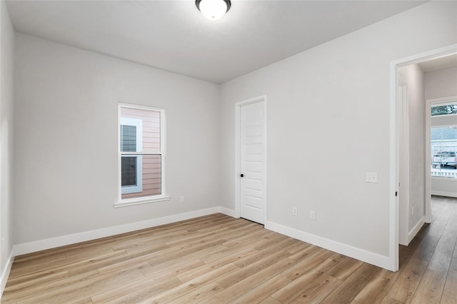 unfurnished room with light hardwood / wood-style floors