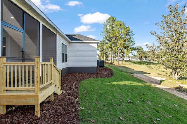 view of yard with central AC unit