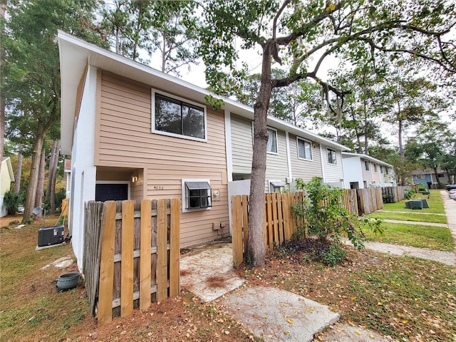 view of side of home featuring central air condition unit