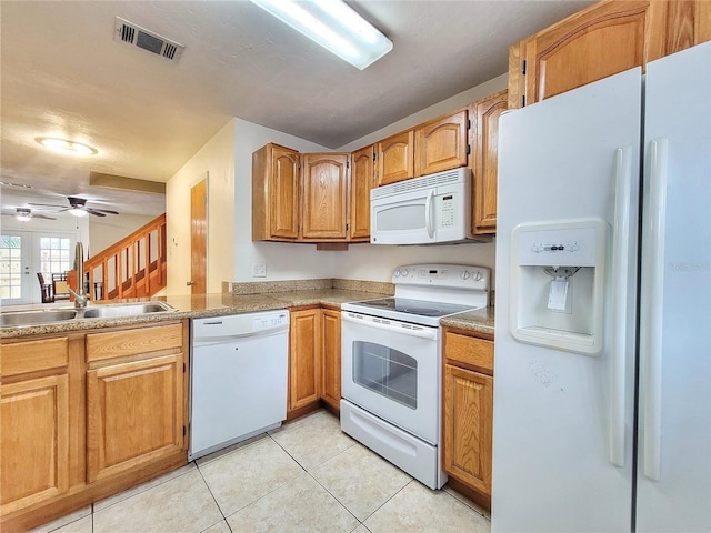 kitchen with light tile patterned floors, white appliances, ceiling fan, and sink