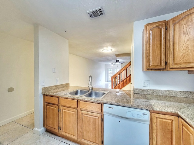 kitchen featuring kitchen peninsula, ceiling fan, sink, light tile patterned floors, and dishwasher