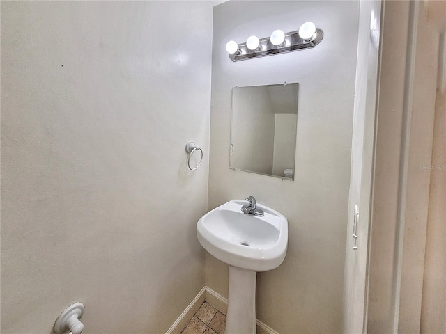 bathroom with tile patterned flooring