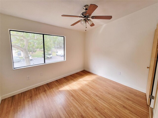 spare room with ceiling fan and light hardwood / wood-style floors