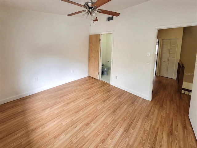 spare room with ceiling fan and light wood-type flooring