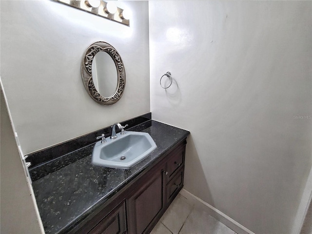 bathroom with tile patterned flooring and vanity