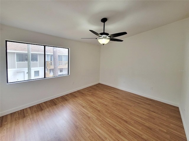 unfurnished room with ceiling fan and light hardwood / wood-style flooring