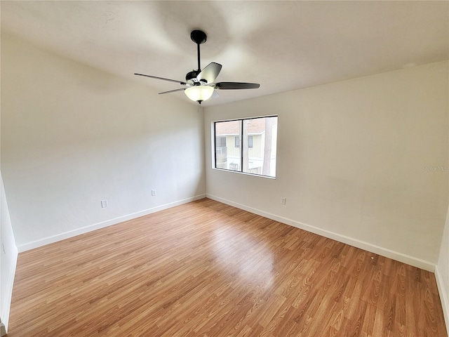 unfurnished room featuring ceiling fan and light wood-type flooring