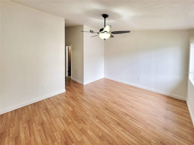 spare room featuring light wood-type flooring and ceiling fan