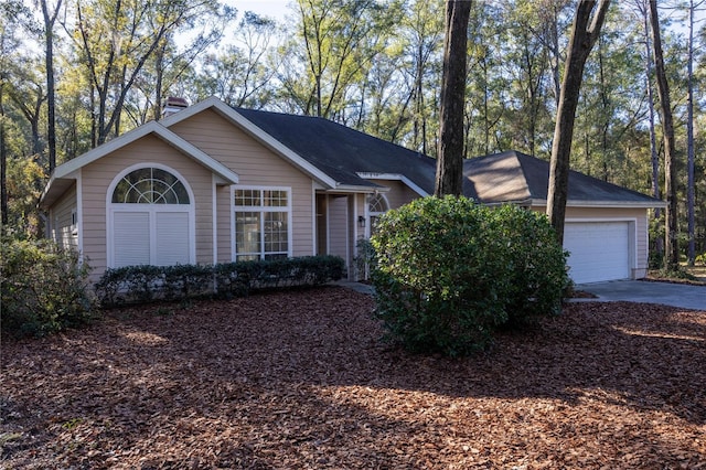 single story home featuring a garage