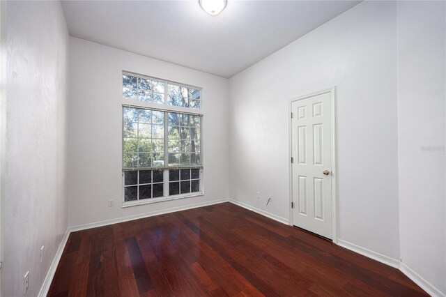 unfurnished room featuring dark hardwood / wood-style floors