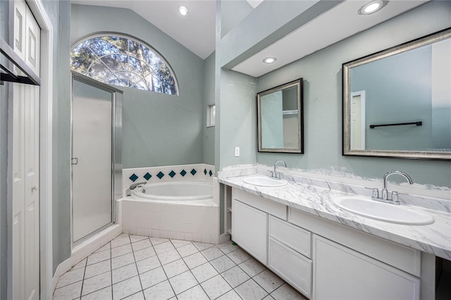 bathroom with tile patterned floors, separate shower and tub, vanity, and lofted ceiling