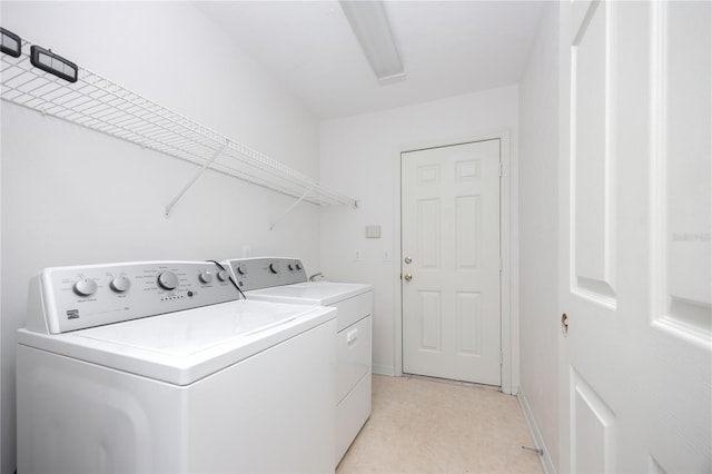 laundry area with washing machine and clothes dryer