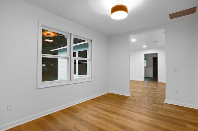 spare room with light hardwood / wood-style floors