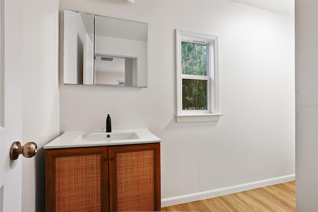 bathroom with wood-type flooring and vanity