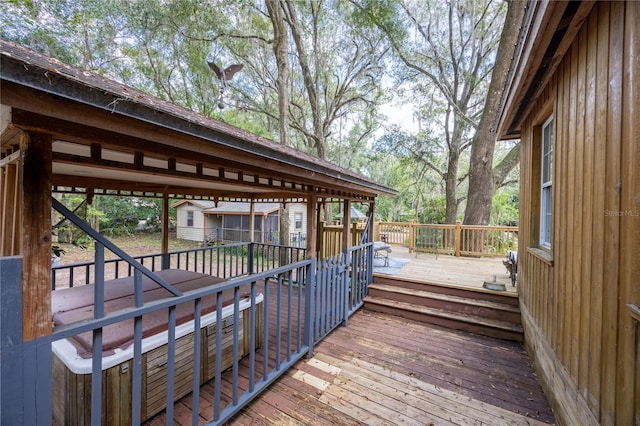 wooden deck featuring an outbuilding