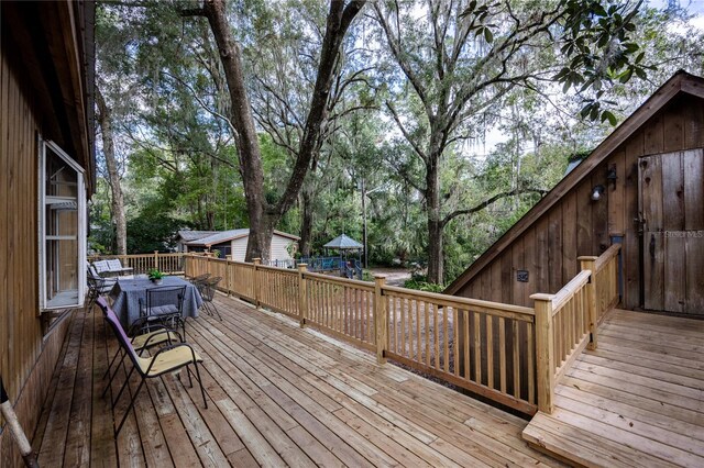 wooden terrace with a playground