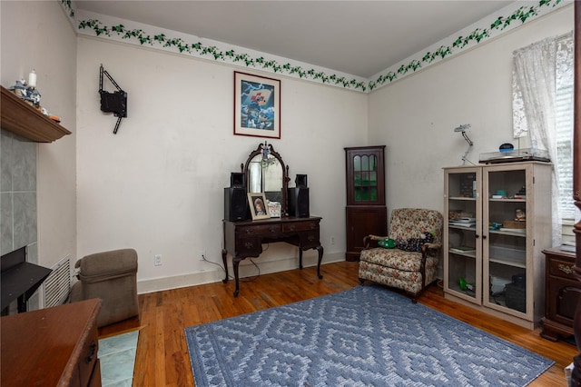 sitting room featuring wood-type flooring