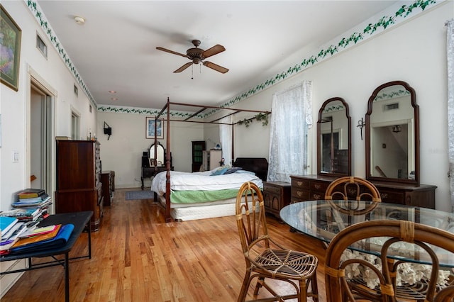 bedroom with ceiling fan and light hardwood / wood-style flooring