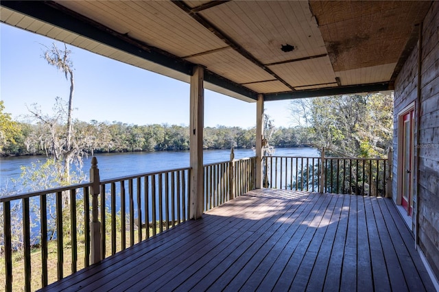 wooden deck featuring a water view