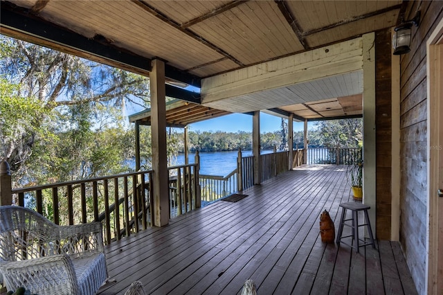 wooden deck with a water view