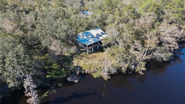 drone / aerial view with a view of trees and a water view