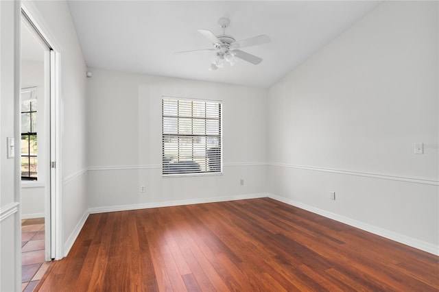 unfurnished room with ceiling fan and dark wood-type flooring