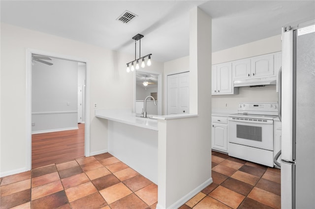 kitchen featuring white cabinets, white appliances, dark hardwood / wood-style floors, and hanging light fixtures