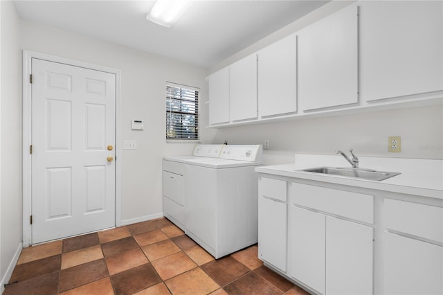 laundry room featuring sink, cabinets, and independent washer and dryer