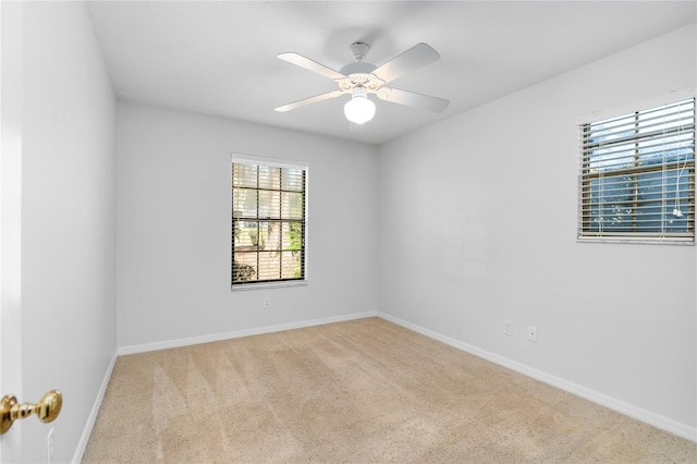 unfurnished room with light carpet and ceiling fan