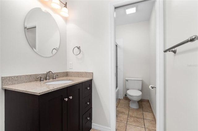 full bathroom featuring tile patterned flooring, vanity, tub / shower combination, and toilet