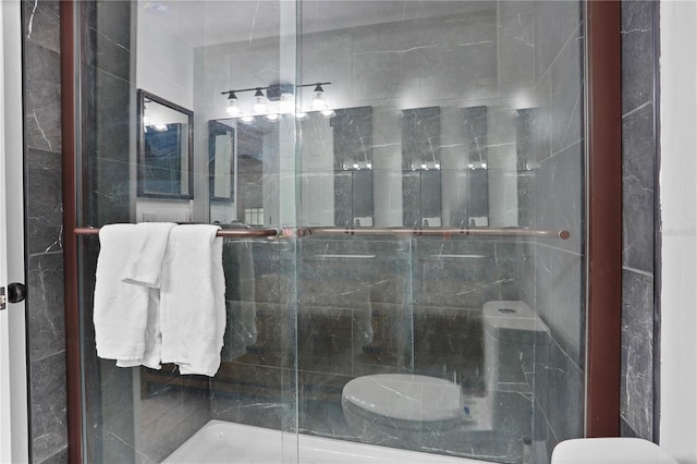 bathroom with a shower with shower door