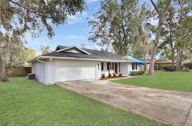 ranch-style house with central AC unit, a garage, and a front lawn