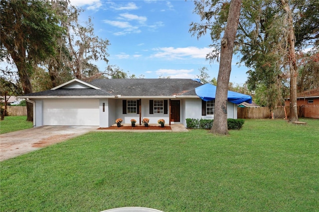 single story home featuring a garage and a front lawn