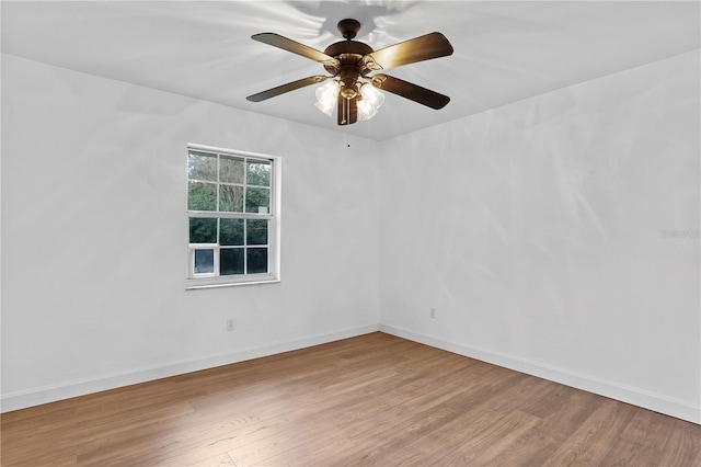 unfurnished room featuring ceiling fan and hardwood / wood-style flooring