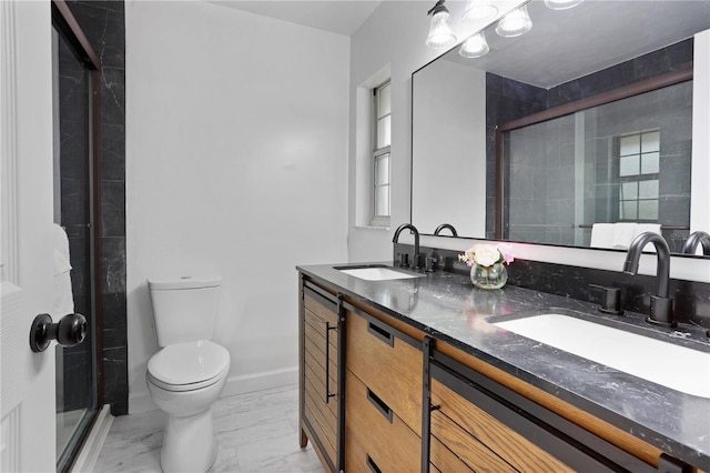 bathroom with vanity, an enclosed shower, and toilet