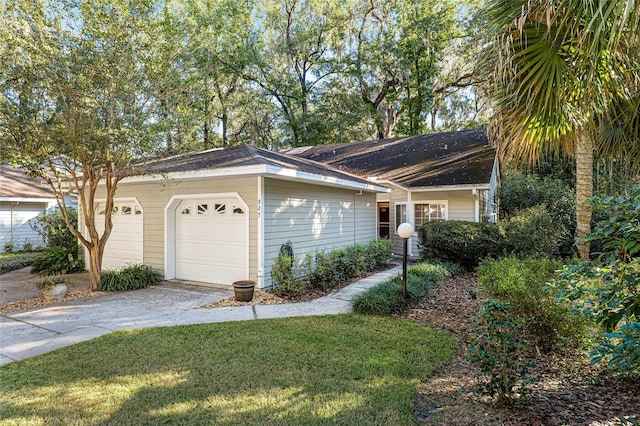 single story home featuring a front yard and a garage