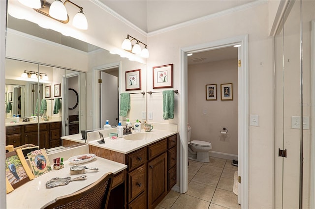 bathroom with crown molding, tile patterned flooring, vanity, and toilet