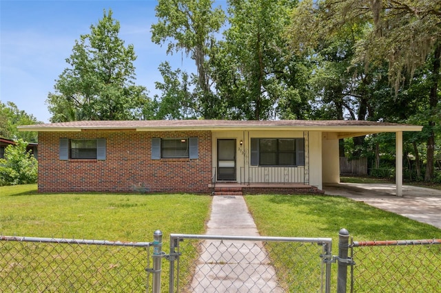 ranch-style home with a carport, covered porch, and a front yard