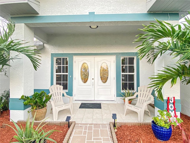 doorway to property featuring a porch