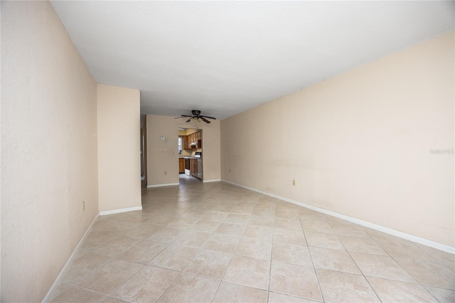 tiled empty room with ceiling fan