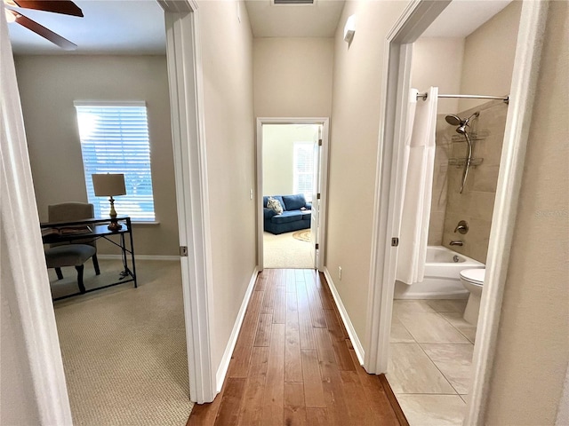 hallway with light wood-type flooring