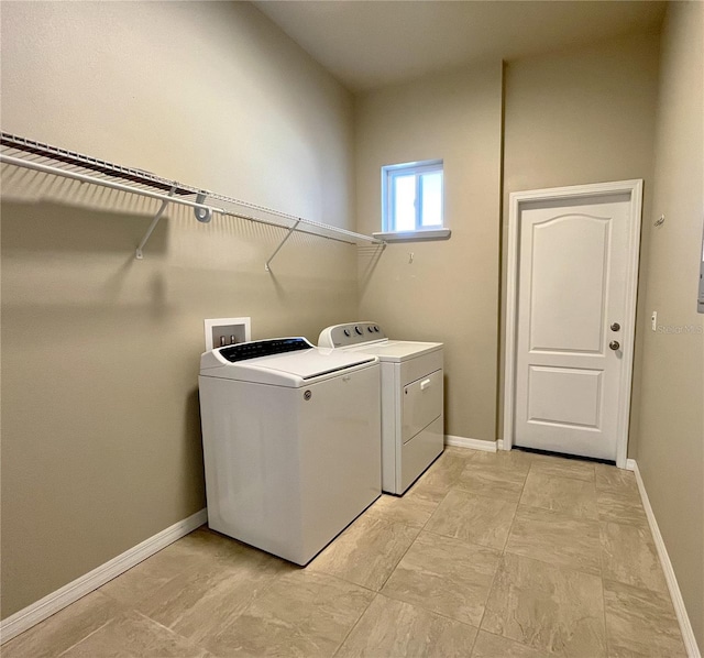 laundry area with washer and clothes dryer