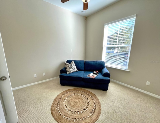 sitting room with carpet floors and ceiling fan