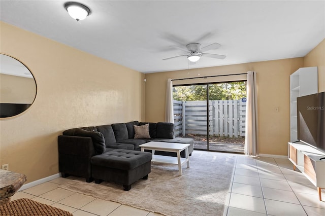 living room featuring light tile patterned floors and ceiling fan