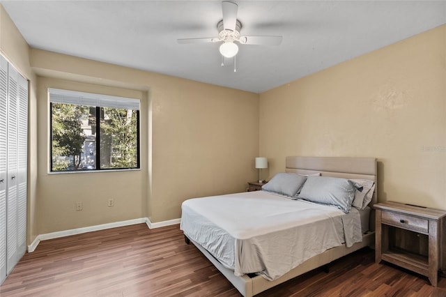 bedroom featuring ceiling fan, a closet, and hardwood / wood-style floors