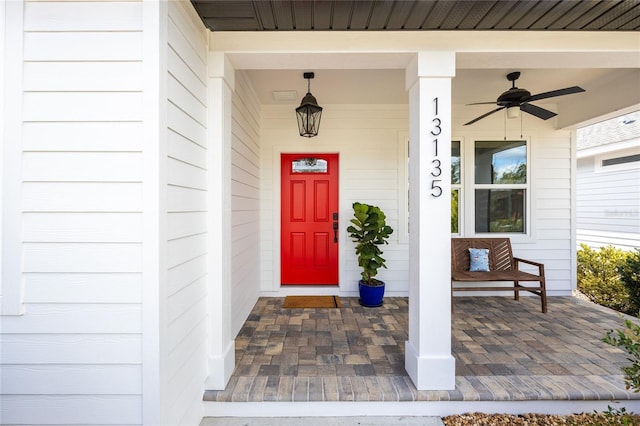 doorway to property with ceiling fan