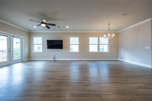 unfurnished living room with crown molding, french doors, ceiling fan with notable chandelier, and dark hardwood / wood-style floors