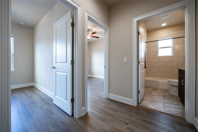 hallway featuring dark wood-type flooring