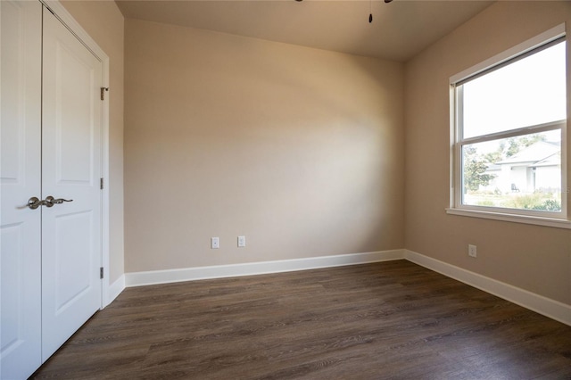 empty room featuring dark wood-type flooring